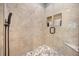 Modern bathroom shower with decorative tile and recessed shelving at 1450 Shady Meadow Ln, Deland, FL 32724