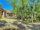Backyard features a pergola and tropical foliage at 1490 Kettledrum Trl, Enterprise, FL 32725