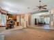 Open-concept living area featuring a kitchen, dining area, and a large window with a breakfast nook at 1490 Kettledrum Trl, Enterprise, FL 32725