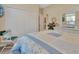 Comfortable bedroom featuring a large closet, cheerful decor and a charming coastal vibe at 1512 Lancashire Way, Deland, FL 32720