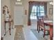 Bright dining area with a window, and decorative flooring, ready for Gathering meals and entertaining at 1512 Lancashire Way, Deland, FL 32720