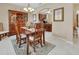 Dining area with furniture set, china cabinet and views to both the kitchen and another living area at 1512 Lancashire Way, Deland, FL 32720