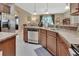 Stylish kitchen featuring stainless dishwasher and ample counter space overlooking the living area at 1512 Lancashire Way, Deland, FL 32720