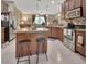 Charming kitchen with stainless appliances and a convenient breakfast bar that opens to the living area at 1512 Lancashire Way, Deland, FL 32720
