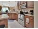 Modern kitchen with stainless steel appliances, sleek countertops, and abundant cabinet space at 1512 Lancashire Way, Deland, FL 32720