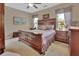 Inviting main bedroom with a large bed, soft carpet, and windows with decorative curtains at 1512 Lancashire Way, Deland, FL 32720