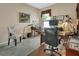 Well lit home office with a large desk, neutral walls, and comfortable seating at 1512 Lancashire Way, Deland, FL 32720