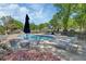 Community pool area with plenty of lounge chairs and shade for everyone to enjoy at 1512 Lancashire Way, Deland, FL 32720