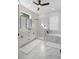 Luxurious bathroom with a double vanity, marble tile shower, and a standalone soaking tub at 1540 Park Forest Blvd, Mount Dora, FL 32757