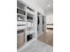 Walk-in closet boasts custom shelving and storage solutions for optimal organization at 1540 Park Forest Blvd, Mount Dora, FL 32757