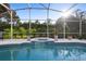 Beautiful pool and patio area with lush tropical landscaping for a resort-like atmosphere at 1540 Park Forest Blvd, Mount Dora, FL 32757