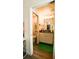 Bright bathroom with granite counters, wood floors, and white cabinets at 1602 15Th St, Orange City, FL 32763