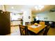 Open-concept living area with laminate floors with kitchen, dining area and furniture at 1602 15Th St, Orange City, FL 32763