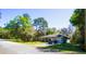 Inviting one-story home featuring manicured lawn, complemented by mature trees and one car garage at 1602 15Th St, Orange City, FL 32763