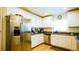 Bright kitchen featuring stainless steel appliances, granite countertops, and white cabinetry at 1602 15Th St, Orange City, FL 32763