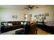 Open-concept living area featuring hardwood floors, cozy seating, and bright natural light at 1602 15Th St, Orange City, FL 32763