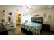 Inviting main bedroom with decorative ceiling fan, ensuite bathroom, and bright window at 1602 15Th St, Orange City, FL 32763
