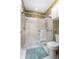 Bathroom featuring a glass enclosed shower with tiled walls and vintage floral wallpaper accents at 1628 Bent Oaks Blvd, Deland, FL 32724