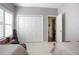 Neutral bedroom with shuttered window, closet, and convenient access to other rooms at 1628 Bent Oaks Blvd, Deland, FL 32724
