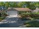 Delightful single Gathering home with a well-maintained lawn, mature landscaping, and a spacious two-car garage at 1628 Bent Oaks Blvd, Deland, FL 32724