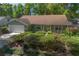 Charming single Gathering home with a well-manicured lawn, lush shrubbery, and an attached two-car garage at 1628 Bent Oaks Blvd, Deland, FL 32724