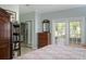 Bedroom featuring an ensuite bathroom and sliding door access to the outdoor living space at 1628 Bent Oaks Blvd, Deland, FL 32724