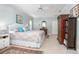 Comfortable bedroom with patterned bedspread, ceiling fan, and ensuite bathroom at 1628 Bent Oaks Blvd, Deland, FL 32724