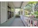 Covered front porch offers shade with ample space for relaxing and enjoying the neighborhood views at 1628 Bent Oaks Blvd, Deland, FL 32724