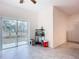 Bright bonus room featuring sliding glass doors that lead to the backyard, providing seamless indoor-outdoor living at 1820 18Th St, Orange City, FL 32763