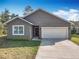 Charming single-story home featuring a two-car garage, neutral stucco siding and manicured landscaping at 1820 18Th St, Orange City, FL 32763