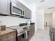 Well-equipped kitchen boasting stainless steel appliances, sleek countertops, and ample cabinet space for storage at 1820 18Th St, Orange City, FL 32763