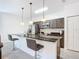 Modern kitchen with a spacious island, stainless steel appliances, and ample cabinet space at 1820 18Th St, Orange City, FL 32763