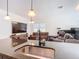 Beautiful open floor plan showing kitchen sink, granite countertop, island, and seating overlooking the living room at 1820 18Th St, Orange City, FL 32763
