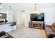 Open-concept floor plan showing the living room that connects to the kitchen and breakfast bar at 1820 18Th St, Orange City, FL 32763