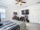 Comfortable main bedroom features a ceiling fan, a large window, and a spacious closet at 1820 18Th St, Orange City, FL 32763