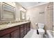 Well-appointed bathroom with double sinks, granite counters, and shower and tub combo at 19 Twin River Dr, Ormond Beach, FL 32174