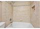 Close up of tile in bathroom. Shows tub, shower head, faucet, and built in niche at 19 Twin River Dr, Ormond Beach, FL 32174