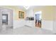Bright dining area with tile flooring and white cabinetry and access to the dinning room at 19 Twin River Dr, Ormond Beach, FL 32174