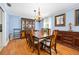 Elegant dining room with wood floors, chandelier, stylish china cabinet, and a large wooden table at 19 Twin River Dr, Ormond Beach, FL 32174