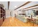 Spacious living room with wood floors, ceiling fan, and exposed beams at 19 Twin River Dr, Ormond Beach, FL 32174