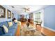 Bright, airy living room with lots of natural light, comfortable seating and a view to dining area at 19 Twin River Dr, Ormond Beach, FL 32174