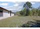 Expansive backyard with lush grass and scattered trees at 2017 Monterey Dr, Deltona, FL 32738