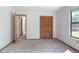 Cozy bedroom with neutral carpet and spacious closet storage at 2017 Monterey Dr, Deltona, FL 32738