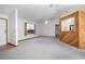 Bright living room featuring a ceiling fan, and unique wood paneled breakfast bar to the kitchen at 2017 Monterey Dr, Deltona, FL 32738