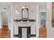 Classic bathroom with vintage-style sink, tiled walls, and decorative mirror at 205 Mary Ave, New Smyrna Beach, FL 32168