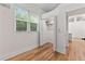 Bright bedroom featuring hardwood floors, a closet, and a window with natural light at 205 Mary Ave, New Smyrna Beach, FL 32168