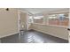 Bedroom featuring gray floors, natural light, and an open doorway to the exterior at 205 Mary Ave, New Smyrna Beach, FL 32168