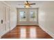 Comfortable bedroom with hardwood floors, neutral walls, natural light, and a ceiling fan at 205 Mary Ave, New Smyrna Beach, FL 32168