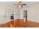 Spacious bedroom with access to a bathroom, fireplace, and hardwood floors at 205 Mary Ave, New Smyrna Beach, FL 32168