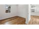 Bright bedroom features hardwood floors and a large window with natural light at 205 Mary Ave, New Smyrna Beach, FL 32168